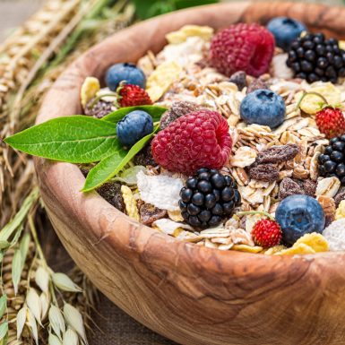 Closeup of granola with milk and fresh berries